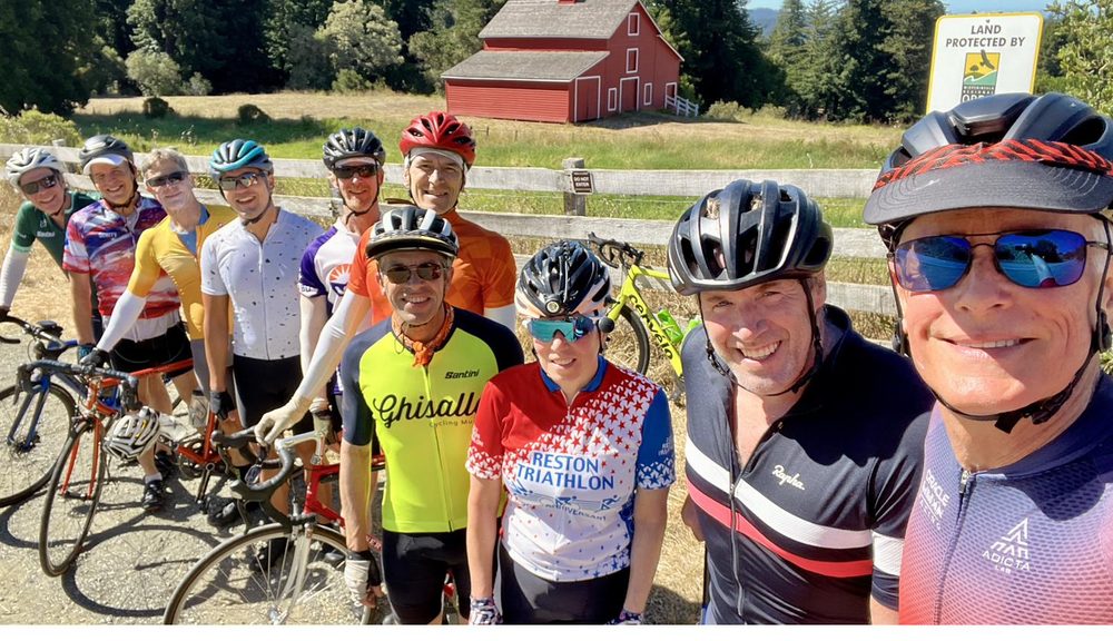 Crick Waters cycling with a group in the Bay Area hills